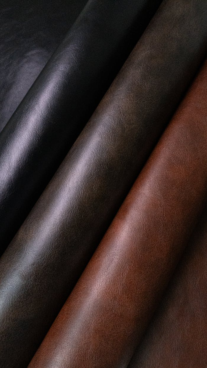 High-quality leather rolls showcasing rich textures and shades, captured in León, Guanajuato.